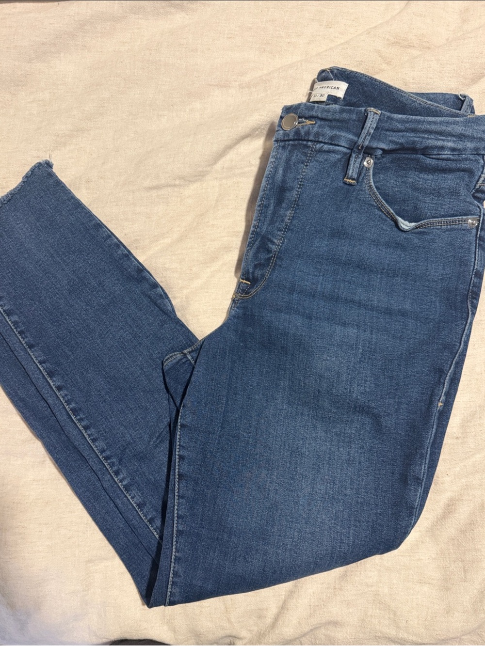 Good American Mid-Rise Skinny Jeans in Medium Blue Denim